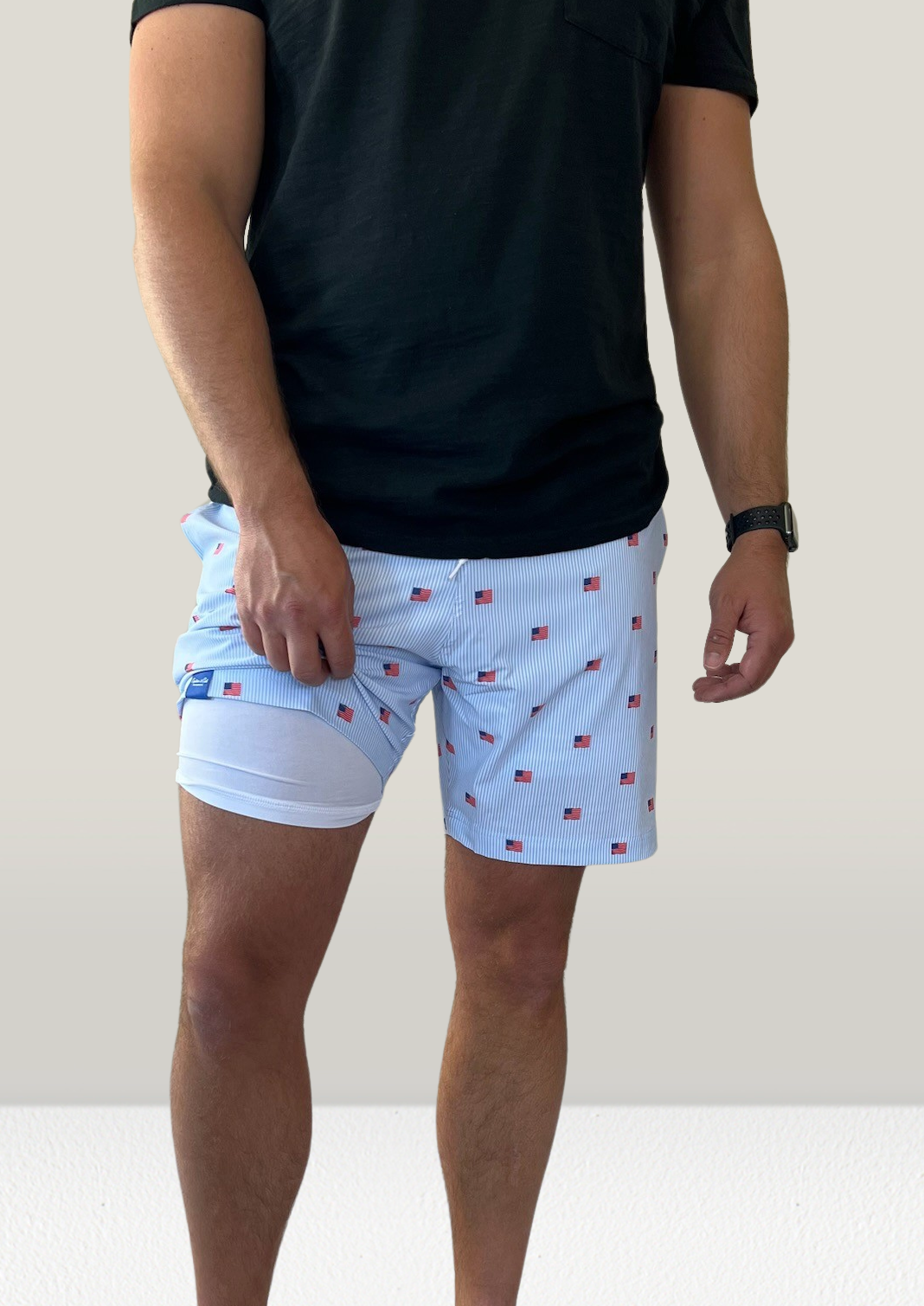 MEN’S FLAG SWIM TRUNKS
